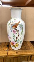 Full view of vase with floral and bird design