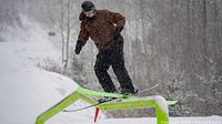 Skier on rail feature at resort