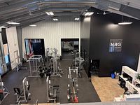 View of strength training area showing machines and free weights