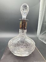 Full view of cut crystal decanter with stopper inserted