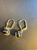 Both sterling silver onyx earrings top view