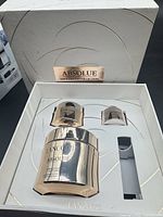 Closed gift box showing Absolue Soft Cream Collection branding and internal layout with three products seated