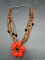 Full view of Chico's multi-strand necklace showing pendant and strands