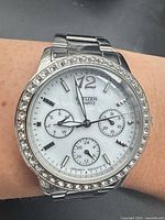 Front view of Citizen watch showing dial, bezel and bracelet