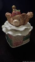 Front view of cookie jar showing bear and patchwork sides