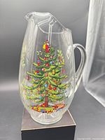 Front view showing Christmas tree motif on pitcher