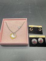 Full lot: Hello Kitty necklace in pink box, two sets of Lapor earrings