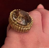 Top view of 14K gold ring showcasing large smoky quartz and textured bezel