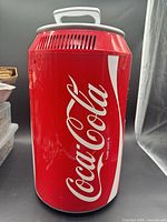 Front view of red Coca-Cola can mini fridge