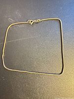Full view of 9 in sterling silver box chain anklet