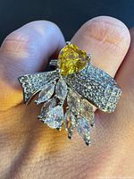 Front view showing heart citrine, pavé bow, marquise drops