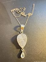 Full view of sterling silver necklace and pendant