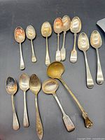 All 14 pieces arranged on black surface