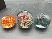 Three paperweights front view