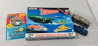 Overall lot: Thunderbirds boxed set, blister card, display-case GTO, two loose vehicles