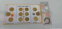 Display card with 12 medallions and sealed Gretzky coin