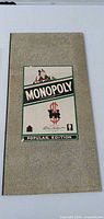 Closed box showing Monopoly Popular Edition lid