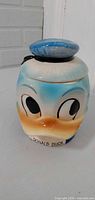Front view of Donald Duck ceramic cookie jar with lid on