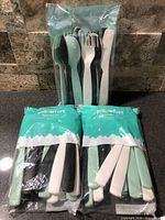 Three sealed Pillowfort flatware packs front view