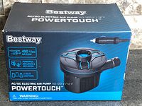 Factory-sealed Bestway Powertouch AC/DC electric air pump retail box showing product image and specifications