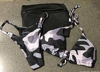 Full set showing bikini top, bottom and mesh bag