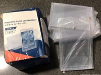 Damaged retail box and seven clear magnetic card holders