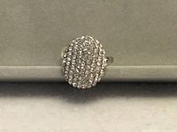 Front view of oval pavé cubic zirconia ring