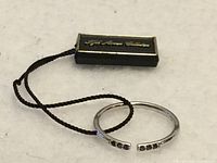 Ring with branded tag showing Fifth Avenue Collection