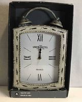 Clock in original box, front view showing face and style