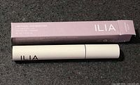 Mascara tube and outer box showing product name and net weight