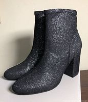 Right profile view showing glitter fabric, block heel