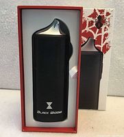 Front view of boxed Black Widow vaporizer in packaging