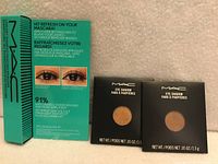 Front view of MAC mascara refresher box and two MAC eye shadow boxes