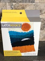 Front of sealed Dimensions Latch Hook'd kit box showing design and brand