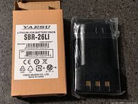 Front of Yaesu SBR-26LI box and sealed battery pack