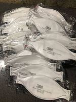 Pile of individually wrapped 3M Aura 9205+ masks