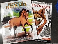 Front covers of both coloring books