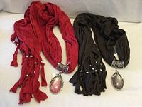 Two crinkle scarves side by side showing full length and pendants