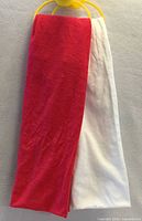 Red and white infinity scarves hanging side by side