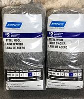 Front view of both sealed Norton steel wool packs