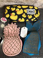 All three pouches side by side to show designs and relative sizes