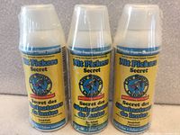 Front view of three sealed Nit Pickers Secret lice treatment bottles