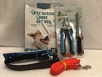 Box of Yegbong gloves, Dudi nail clippers with file, RC Pets collar, red leash