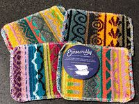 Four Euroscrubby rectangular scrubbers, one with original round tag visible