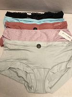 Five folded underwear pairs showing colours and La Vie en Rose tag