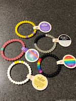 All five Life silicone beaded bracelets with tags