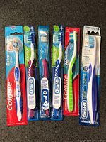 All six sealed toothbrushes lined up front view