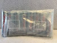Shrink-wrapped pack of eight Tenergy batteries side view