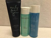 Front view of three skincare products standing side by side