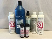 All eight Redken products grouped together showing labels and sizes